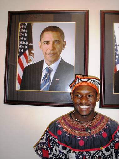 Akere in traditional outfit meeting with Grant Harris