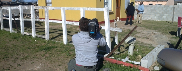 Judges inspect the house after completion by family members